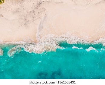 Tropical sandy beach with turquoise ocean and waves. Aerial view - Shutterstock ID 1361535431
