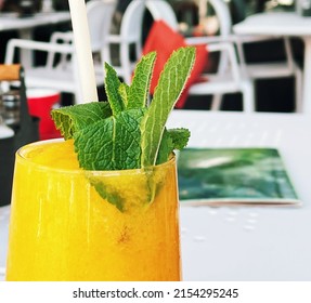 Tropical Smoothie With Mint, Mango, Banana, Pineapple Fruit Drink, Healthy Food Concept