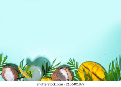 Tropical Summer Background With Hat, Mango, Coconut Tropical Fruits, Palm Leaves, Headphones. Summer Holiday Vacation Flatlay, Leisure Travel Concept. Top View Copy Space For Text