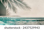 Tropical summer background with plaster wall, pool water and palm shadow. Luxury hotel resort poolside scene mockup template. Beach vacation holiday house with neutral architecture aesthetic.