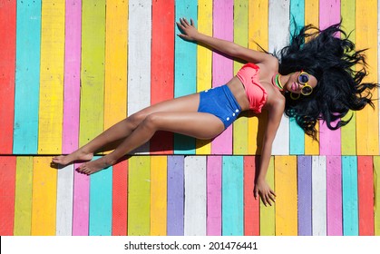 Tropical Summer Holiday Fashion Vogue Concept - African American Woman On A Wooden Pier Background 