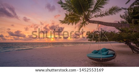Similar – Image, Stock Photo Sunset, stone beach with small and large rocks in front of the illuminated sea