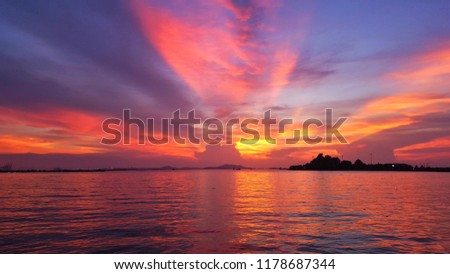 Tropical sunset on the beach. purple sky.