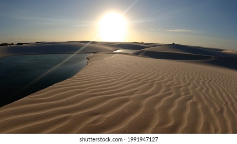 Tropical Sunset Scenery Of Vacations On Exotic Destination In Brazil. Lençois Maranhenses National Park, Maranhao, Brazil. Sunset At Sand Dunes And Rainwater Lakes Landscape. Brazil Northeast.