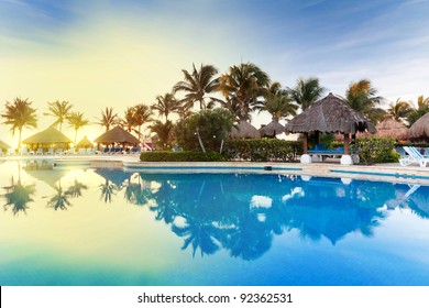 Tropical swimming pool at sunrise in Mexico - Powered by Shutterstock