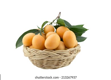 Tropical Thai Fruit. Maprang, Marian plum, Gandaria, Plum mango in bamboo basket isolated on white with clipping path 
