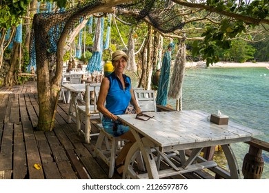 Tropical Vacation, Female Relaxing Beachfront Restaurant