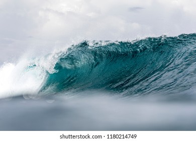 Tropical Wave, a good surfing wave braking along a reef in South Sumatra 