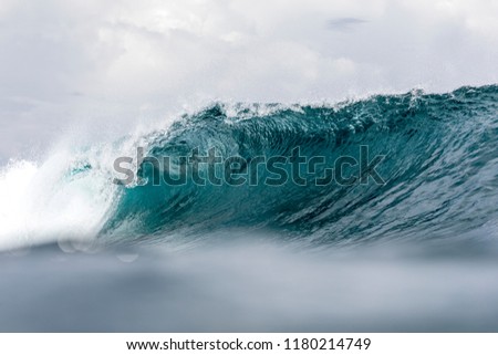 Tropical Wave, a good surfing wave braking along a reef in South Sumatra 