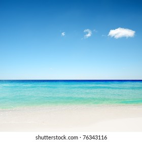 Tropical White Sand Beach And Blue Sky.