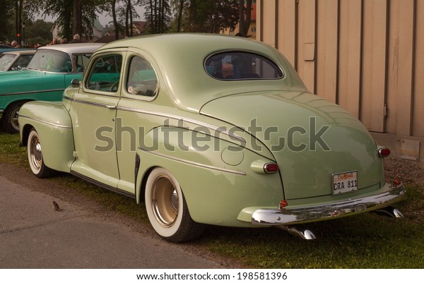 Trosa Sweden, June 5, 2014 veteran car\
meeting. FORD SUPER DE LUXE COUPE, model year\
1946.