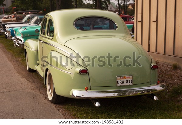 Trosa Sweden, June 5, 2014 veteran car\
meeting. FORD SUPER DE LUXE COUPE, model year\
1946.