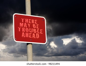 Trouble Ahead Sign Against A Dark Cloud Background