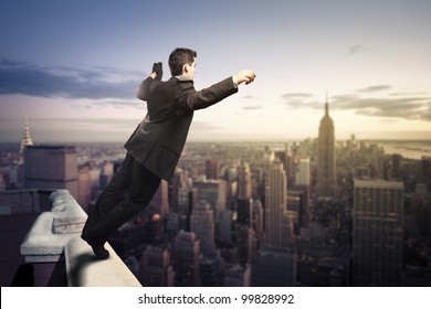 Troubled Businessman Jumping From The Top Of A Building