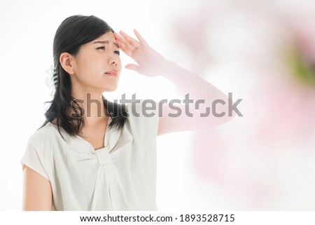 Troubled face woman with hands on head, Image of spring stress
