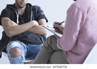 Troubled teenager during meeting with his psychologist