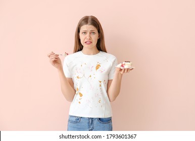 Troubled Woman In Dirty Clothes Eating Dessert On Color Background