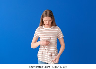 Troubled Woman In Dirty Clothes And With Napkin On Color Background