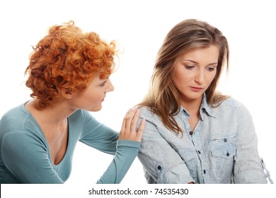 Troubled young girl comforted by her friend. Isolated on white background