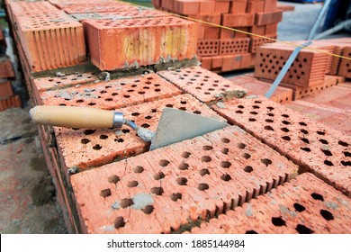 Trowel For Applying Cement Between Bricks While Constructing A Building Wall, Close-up Of Brickwork Construction Work, Nobody.