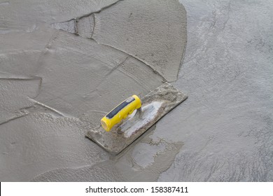 Trowel On Fresh Concrete At Construction Site 