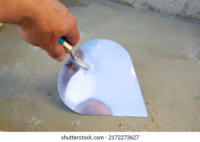 Trowel on fresh concrete at construction site,cement trowel,masonry trowel, screed leveling
