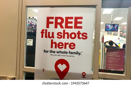 TROY, MICHIGAN, USA - MARCH 24, 2021 Signs In Front Of A CVS Health Drugstore Advertise The Availability Of Flu Shots For Free