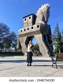 Troy, Turkey - March 2021 Wooden Trojan Horse And Young Woman 