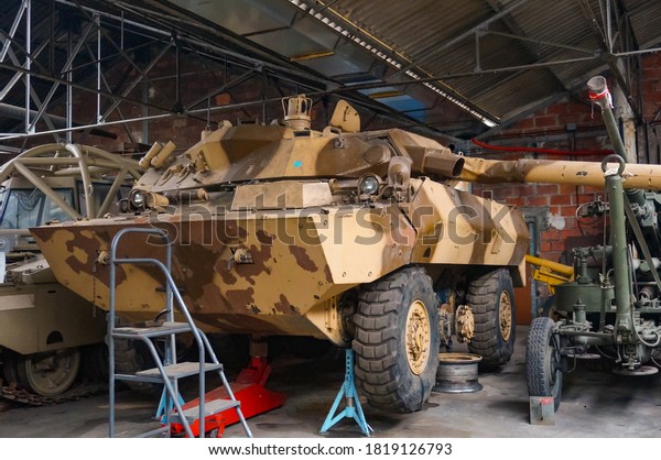Troyes, France - Sept. 2020 - Turned turret of\
a Giat Industries AMX-10 RC under repair, a 6×6 wheeled armored\
recomnaissance vehicle once used by the French Army, featuring a\
105 mm autocannon