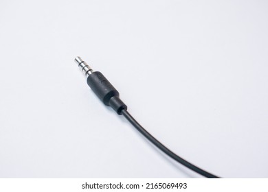 TRRS audio jack with braided cable isolated on white background