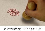 Truce stamp and stamping hand. Armistice, peace, stop war and cease-fire concept.
