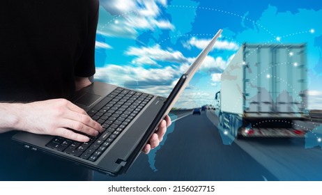 Truck Business. Truck Driver Tracking Via Internet. Logistician With Laptop. Concept Truck Dispatcher Business. Lorry Is Driving Down Road. Silhouettes Of Continents In Front Of Road.