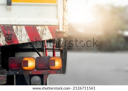ฺBeside of truck car open turn signal. Stop on the empty road.