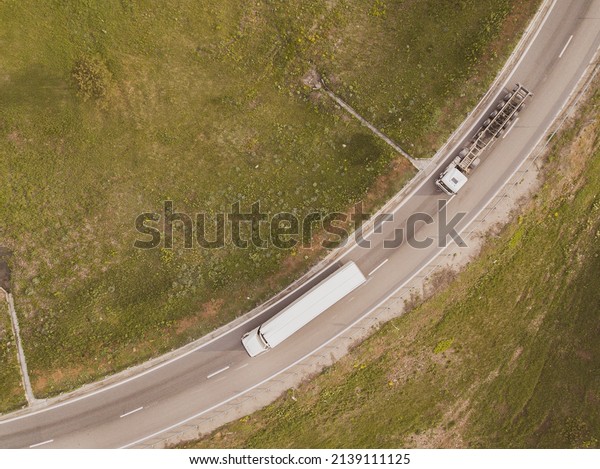 Truck with Cargo\
Semi Trailer Moving on Road in Direction. Highway intersection\
junction. Aerial Top View