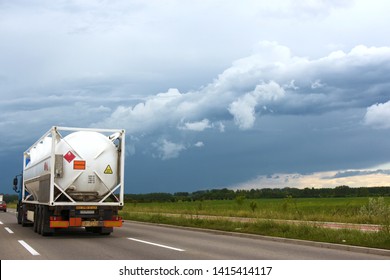 Truck Carrying Portable Fuel Tank Races On A Highway Against The Storm