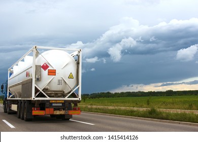 Truck Carrying Portable Fuel Tank Races On A Highway Against The Storm