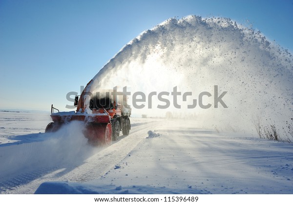 truck cleaning road in\
winter