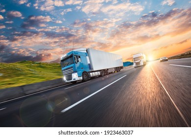 Truck with container on highway, cargo transportation concept. Shaving effect. - Shutterstock ID 1923463037