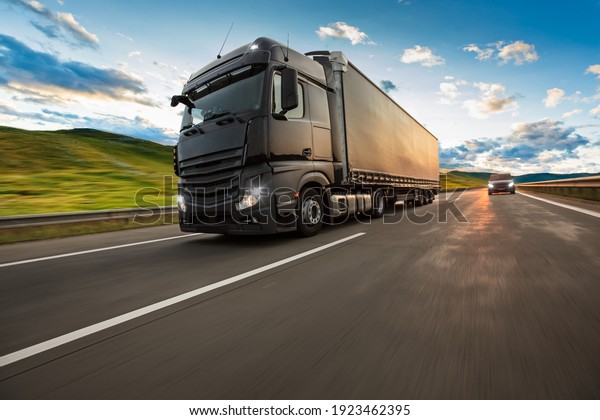 Truck with container on highway, cargo
transportation concept. Shaving
effect.
