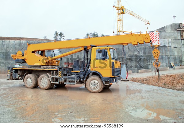 Truck crane standing on a\
construction site under construction hydropower plants in Grodno\
Belarus