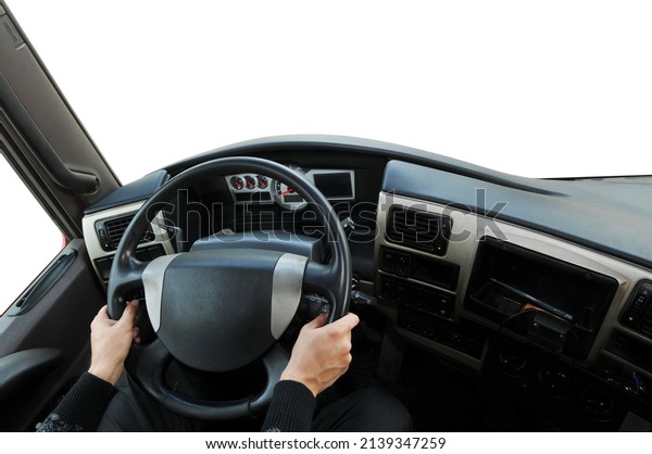 Truck dashboard with driver\'s hand\
on the steering wheel against isolated on a white\
background