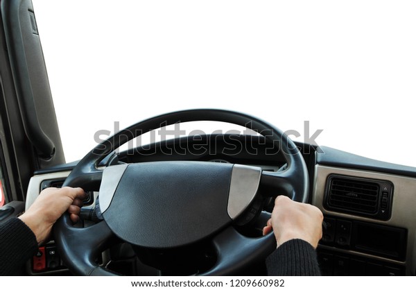 Truck dashboard with driver\'s hands on\
the steering wheel isolated on a white\
background