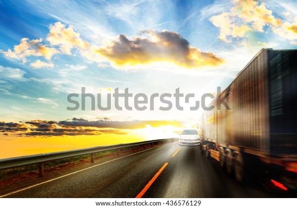 Truck\
driver blinded by the sun moving a collision\
course