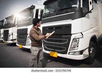 Truck Driver Is Checking The Semi Truck's Engine Maintenance Repairing Checklist. Repairman Auto Service Shop. Inspection Safety Before Driving. Shipping Cargo Freight Truck Transport Logistics.	
