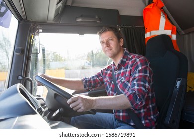 Truck Driver Driving In Cab Of Semi-truck