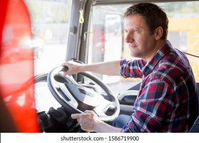 Truck Driver Driving In Cab Of Semi-truck