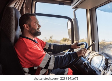 Truck driver driving on the highway, seen from inside the cab.