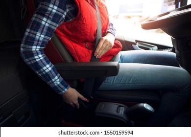 Truck Driver Fastening Seat Belt For Safety. Buckle Up.