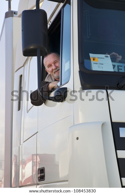 Truck driver and his\
truck - close up