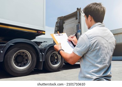 Truck Driver Holding Clipboard Is Checking The Truck's Safety Maintenance Checklist. Mechanic Repairman Shop. Inspection Of Semi Truck Wheels Tires.Shipping Cargo Freight Truck Transport Logistics.		
